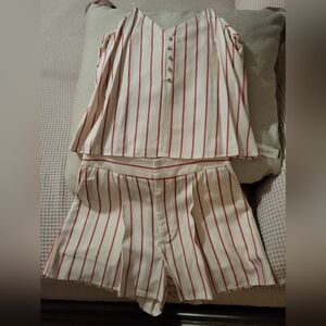 Two piece short set. Shorts has front pockets.